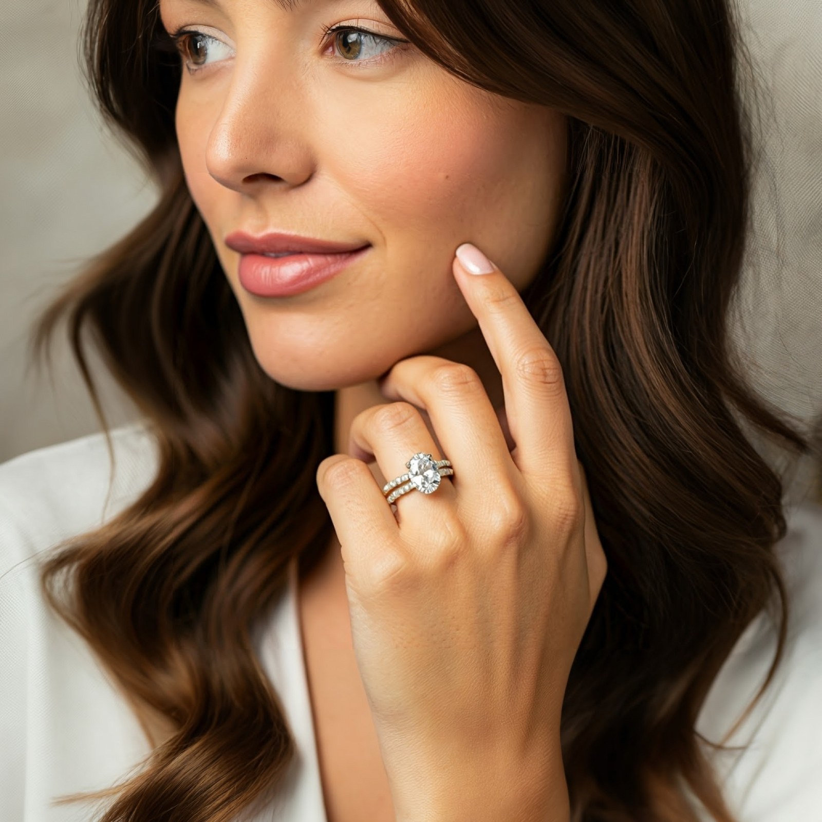 Woman wearing an oval diamond engagement ring